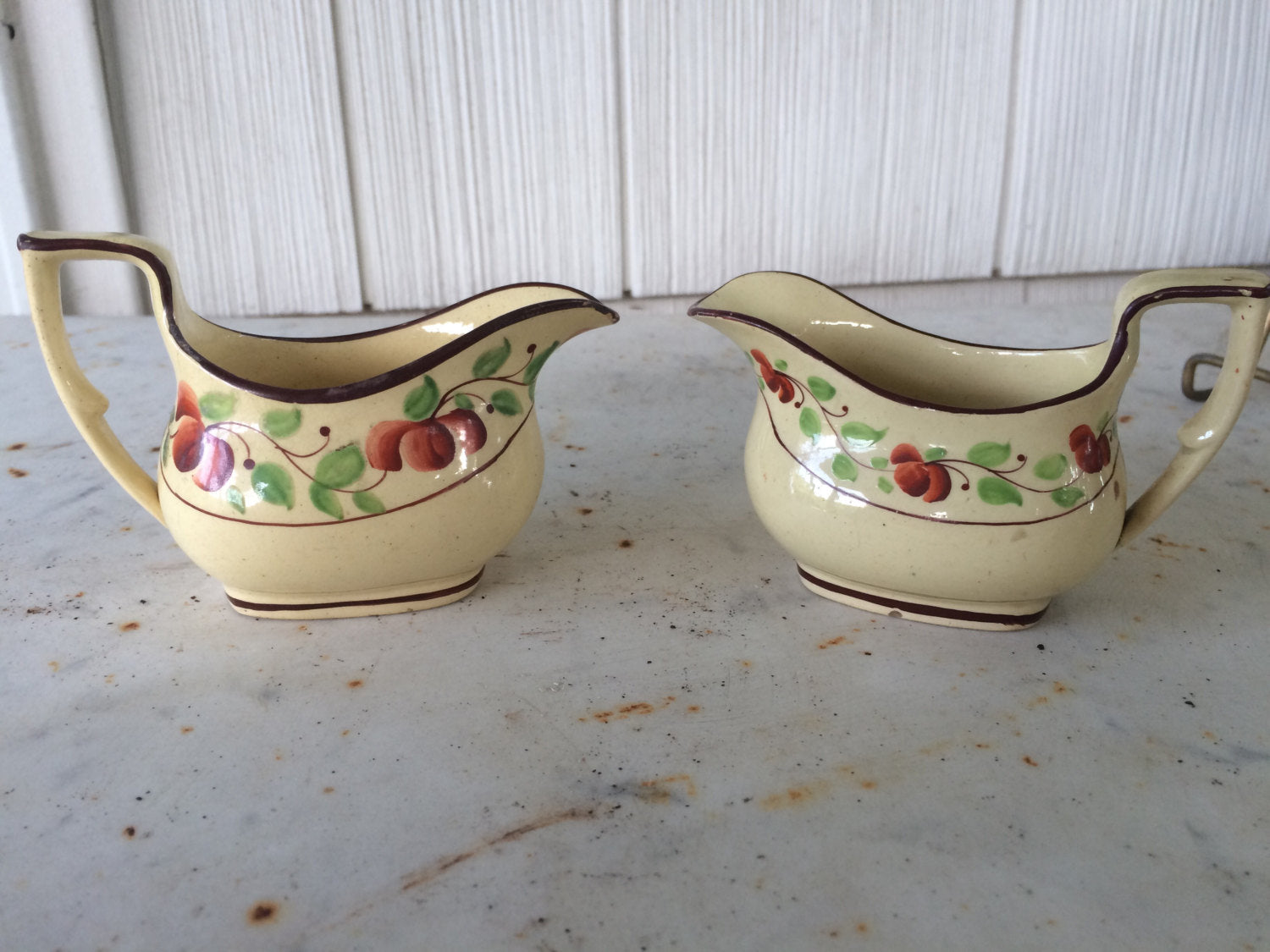 Pair of English miniature creamers from childs tea set.